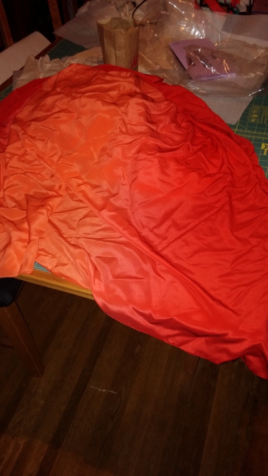 THAT SILK CREPE, THO. Red to coral to orange and back again, starring Bilbo Baggins...